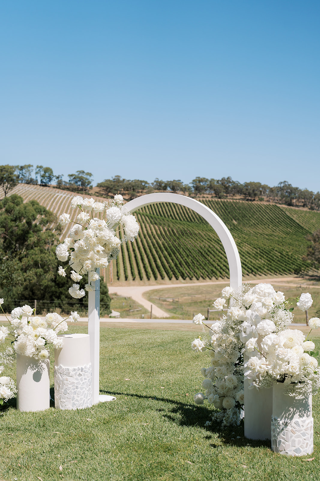 White Arch Arbor with white flowers in Adelaide Hills Vineyard