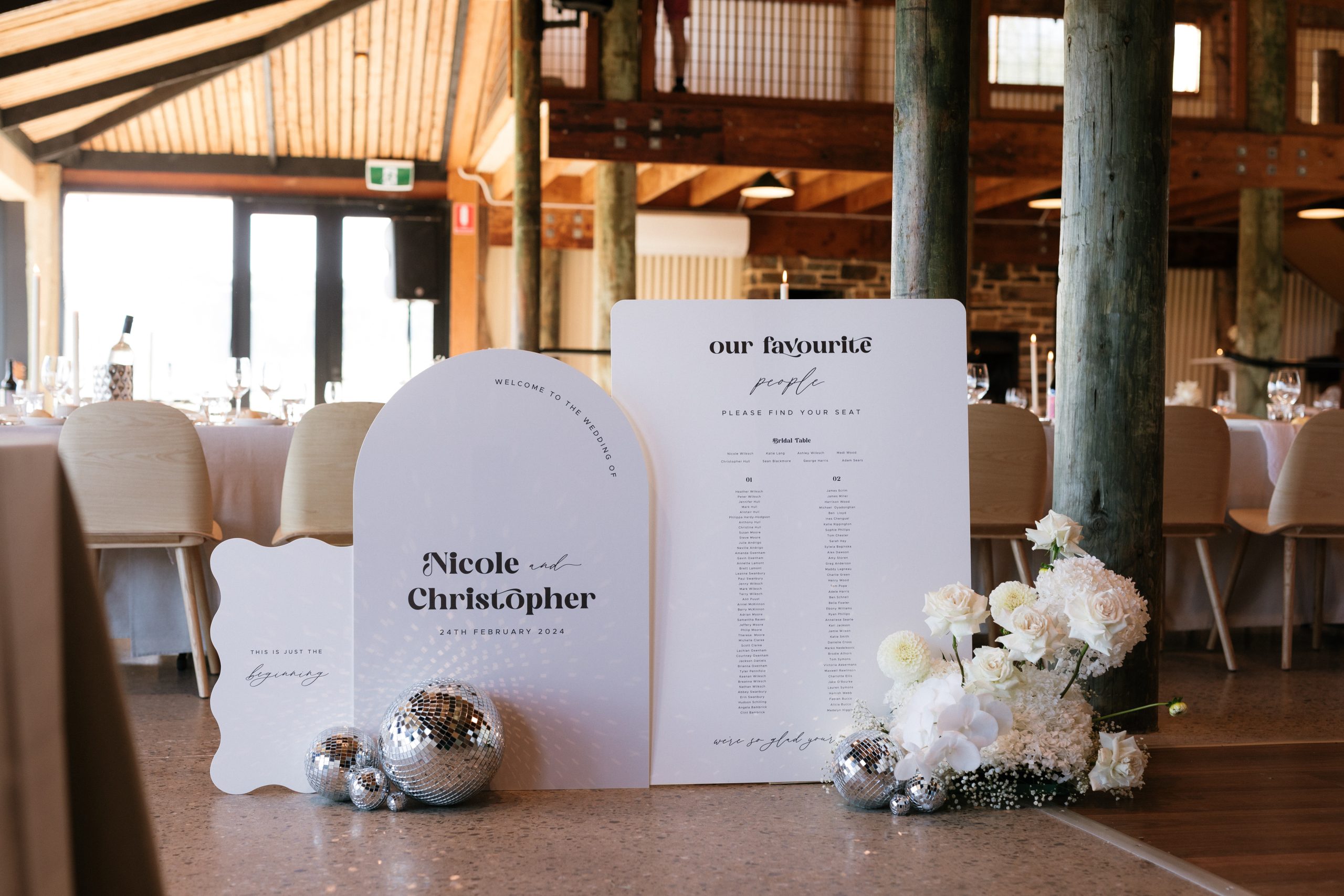 White Wedding Signage with white flowers and disco balls at Longview Vineyard. Styled by The Modern Approach. Jack Small Photography