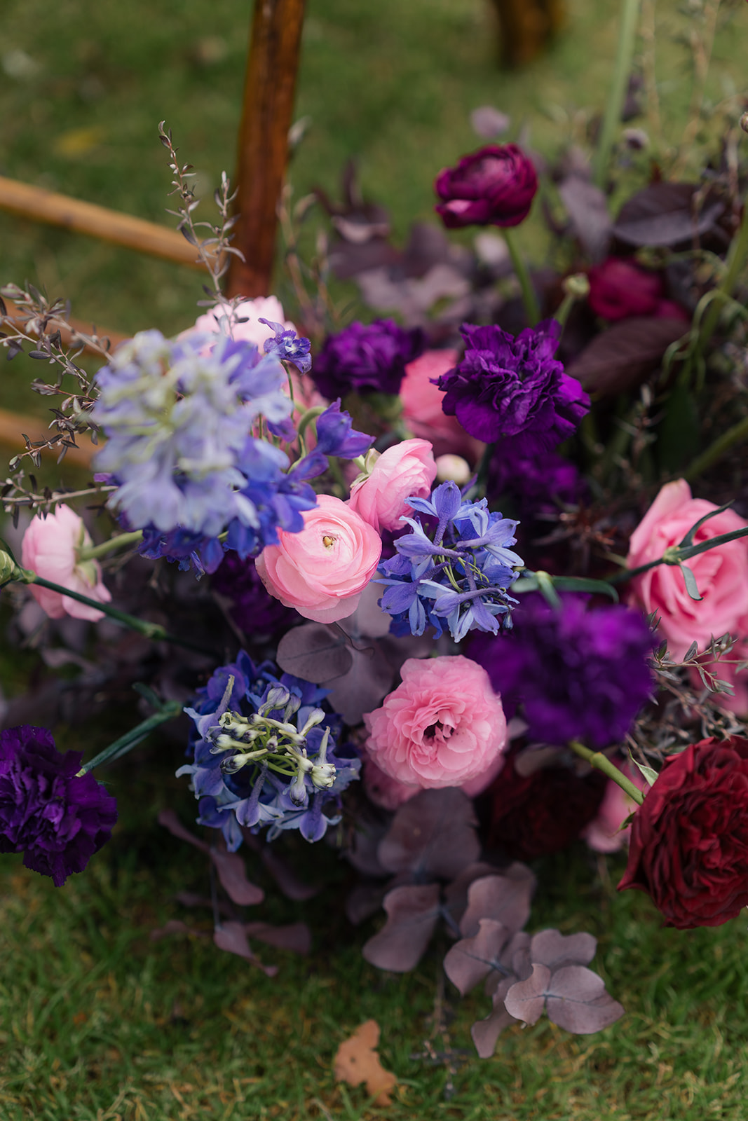 Etherial Botanica wedding florals in dark purple and pink tones to suit the couples moody rustic elegance brief