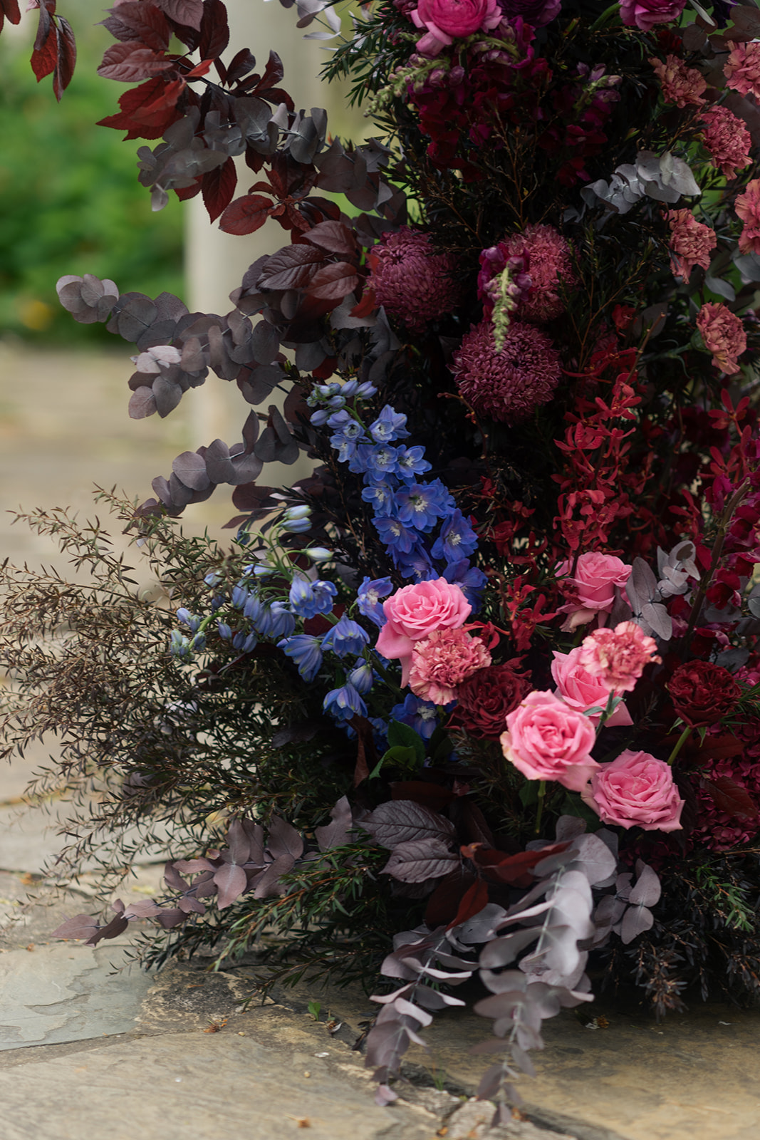 Etherial Botanica wedding florals in dark purple and pink tones to suit the couples moody rustic elegance brief