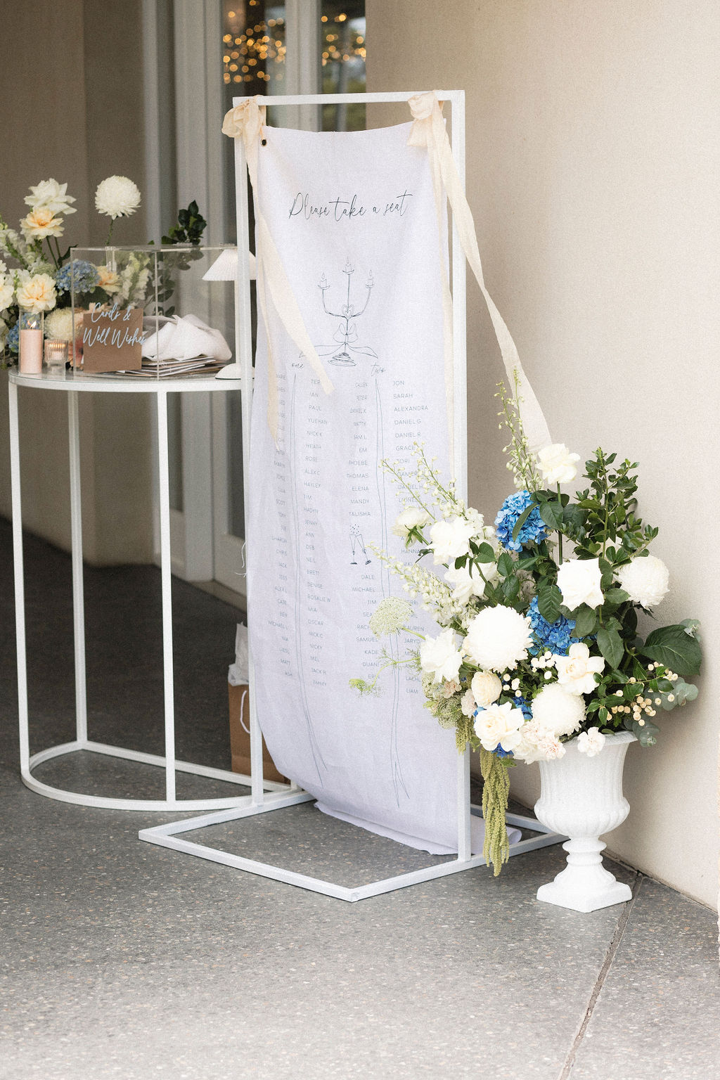 Photograph by Tash Mohring of White Linen wedding sign with silk ribbons for The Modern Approach at LLoyd Brothers Winery, Mclaren Vale