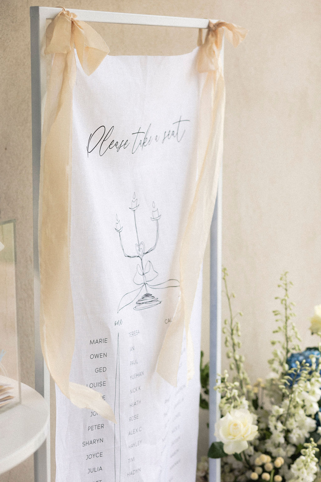 Photograph by Tash Mohring of White Linen wedding sign with silk ribbons for The Modern Approach at LLoyd Brothers Winery, Mclaren Vale