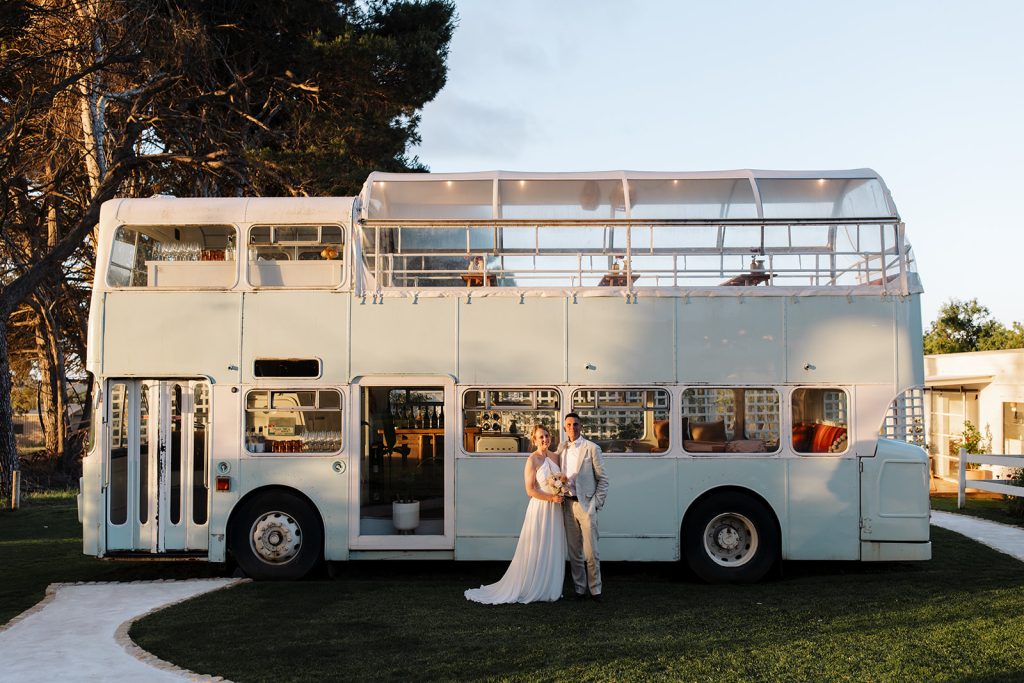 Bride and Groom in front of bus at Down the Rabbit Hole Winery for an intimate wedding in Adelaide's South