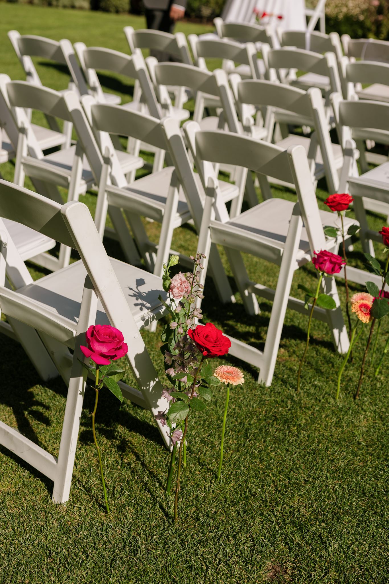Roses at end of seats for wedding aisle seating Colourful Wedding Styling at Goldings Winery Adelaide