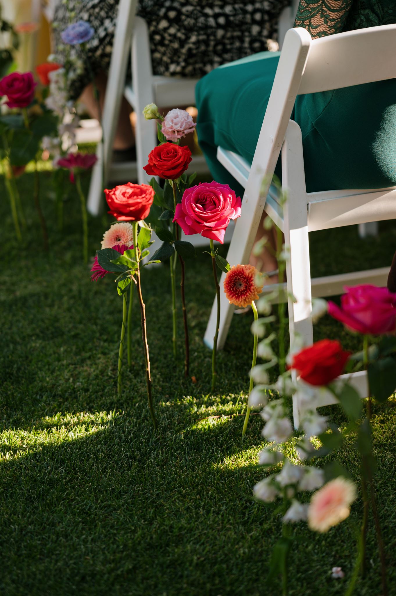 Aisle flowers directly in lawn at Colourful Wedding Styling at Goldings Winery Adelaide
