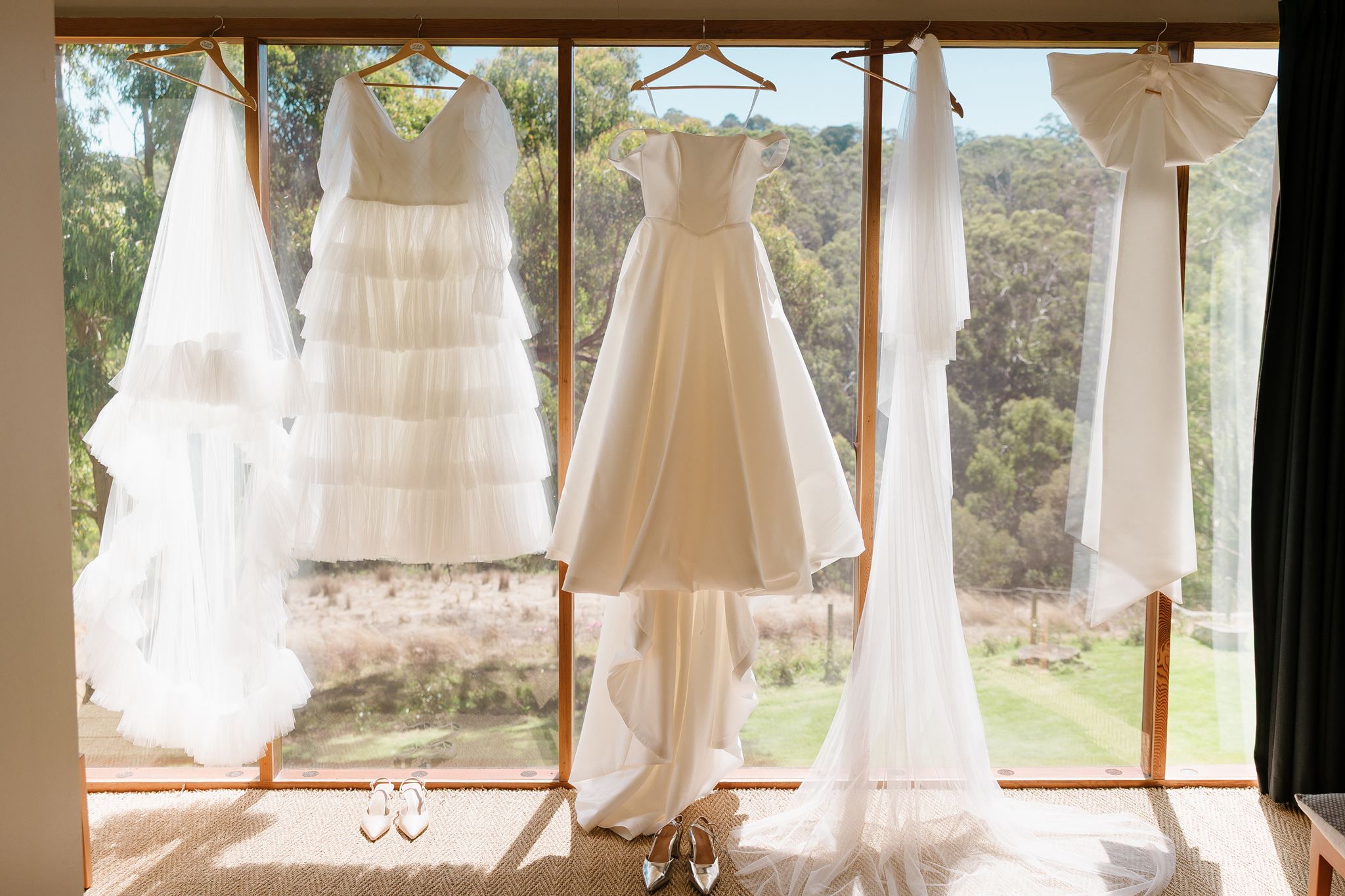 Bridal dresses hanging in window