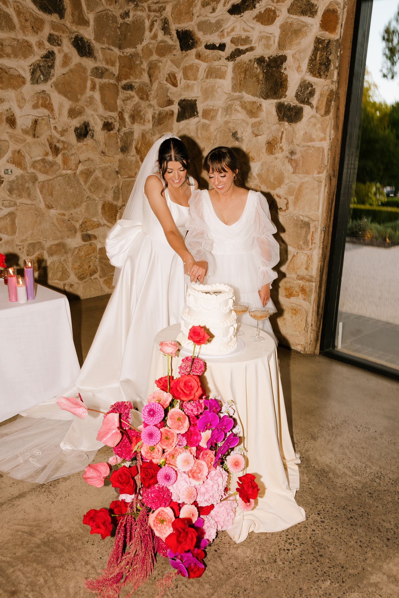 Brides cutting the cake att Colourful Wedding Styling at Goldings Winery Adelaide