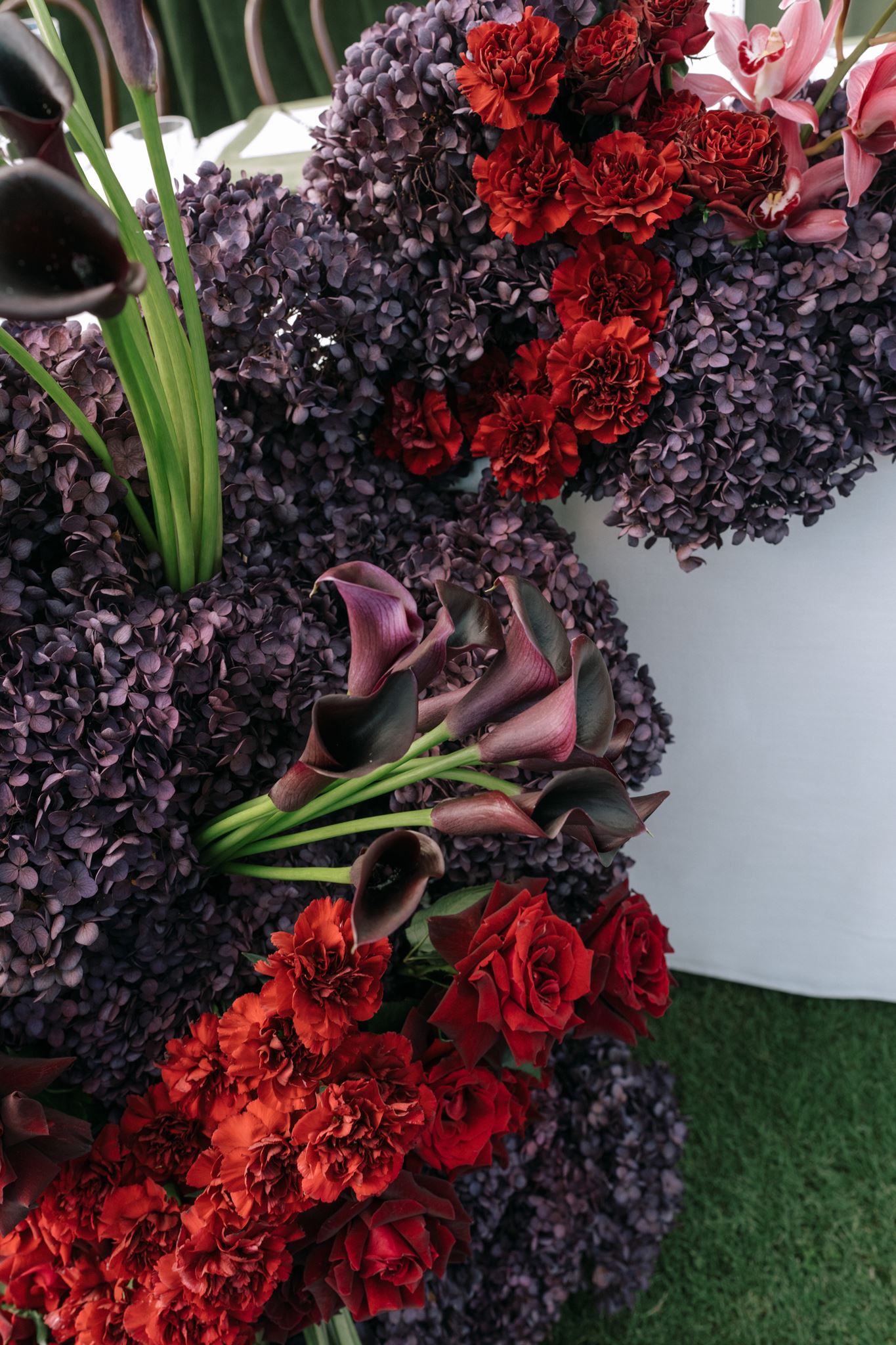 Close up of dark red and purple floral floor display