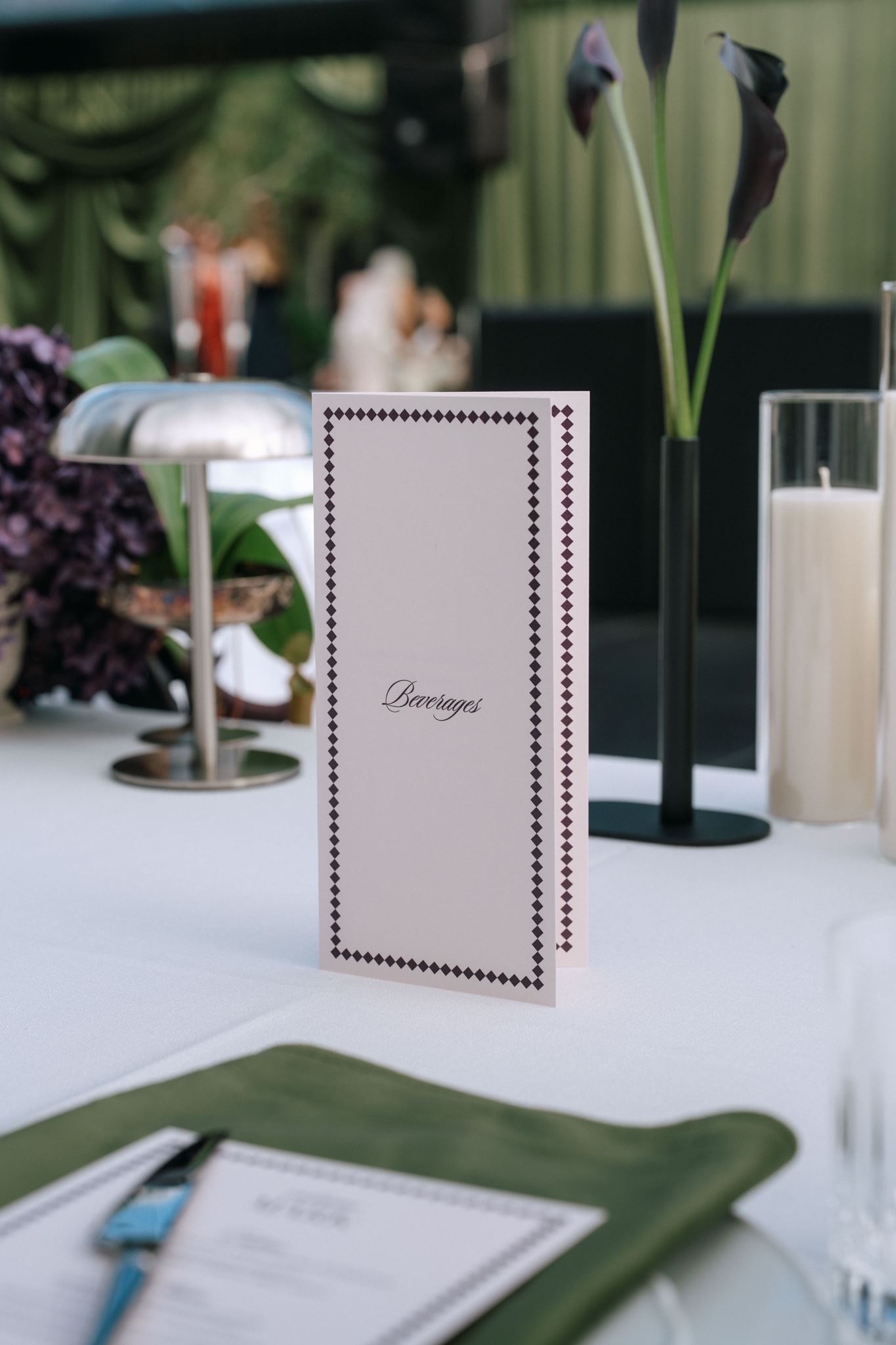 Personalised beverages menu on wedding reception table