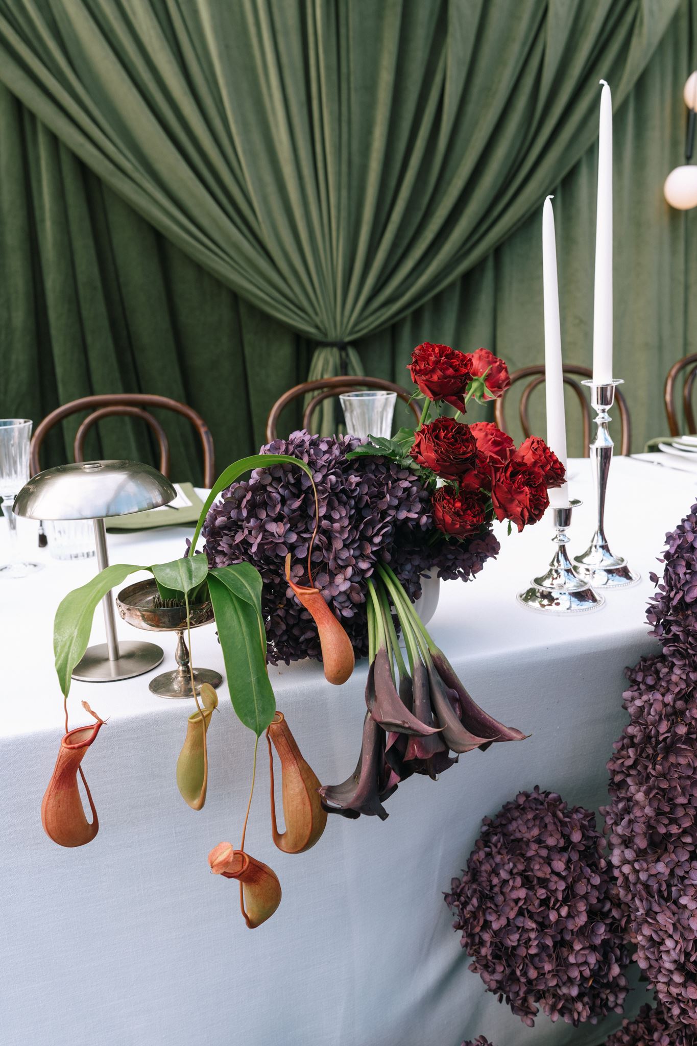 Unique dark floral display on bridal table at Whites Valley Estate