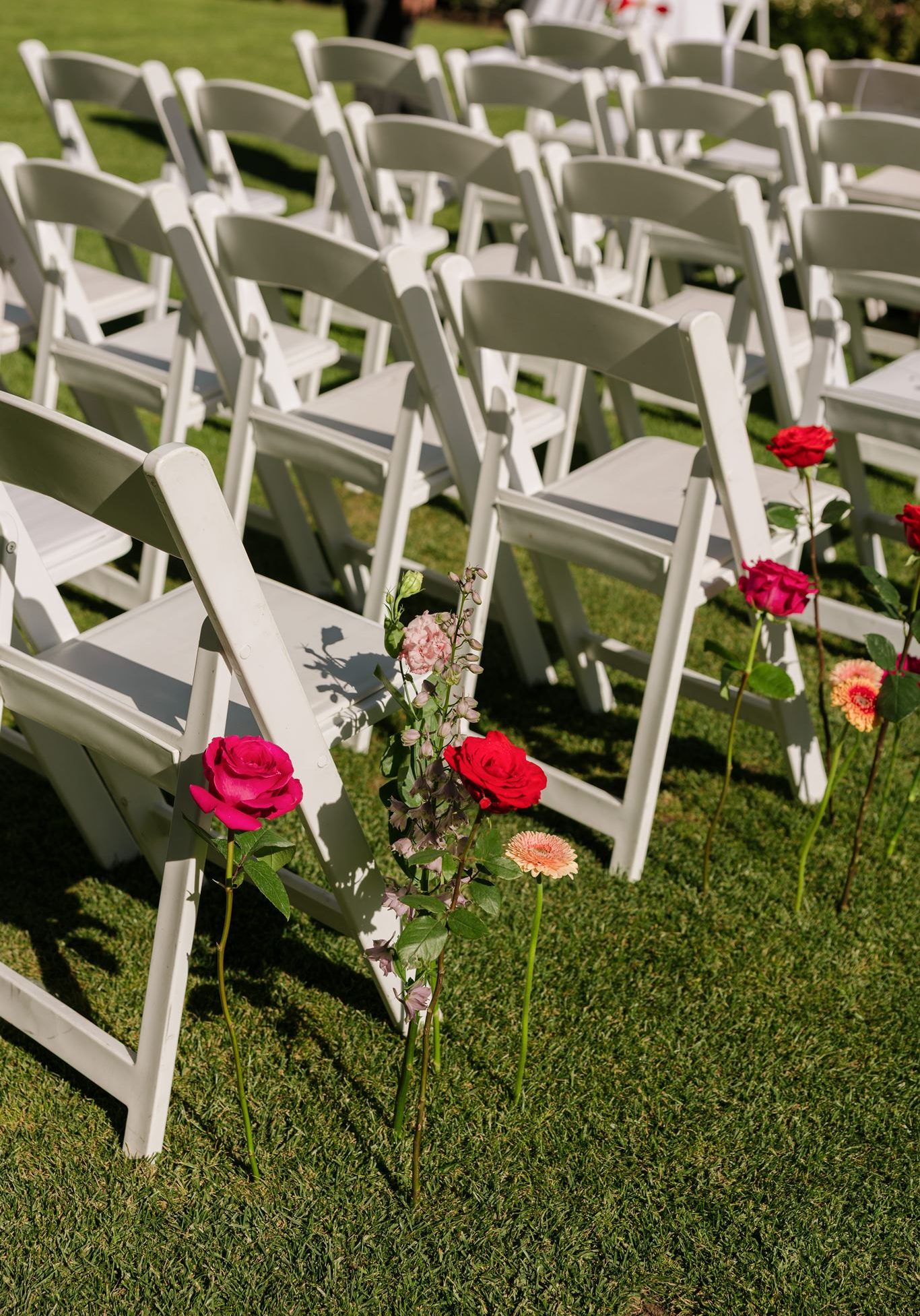 Roses at end of seats for wedding aisle seating Colourful Wedding Styling at Goldings Winery Adelaide