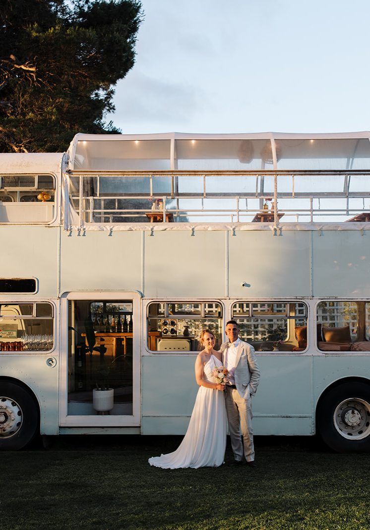 Bride and Groom in front of bus at Down the Rabbit Hole Winery for an intimate wedding in Adelaide's South