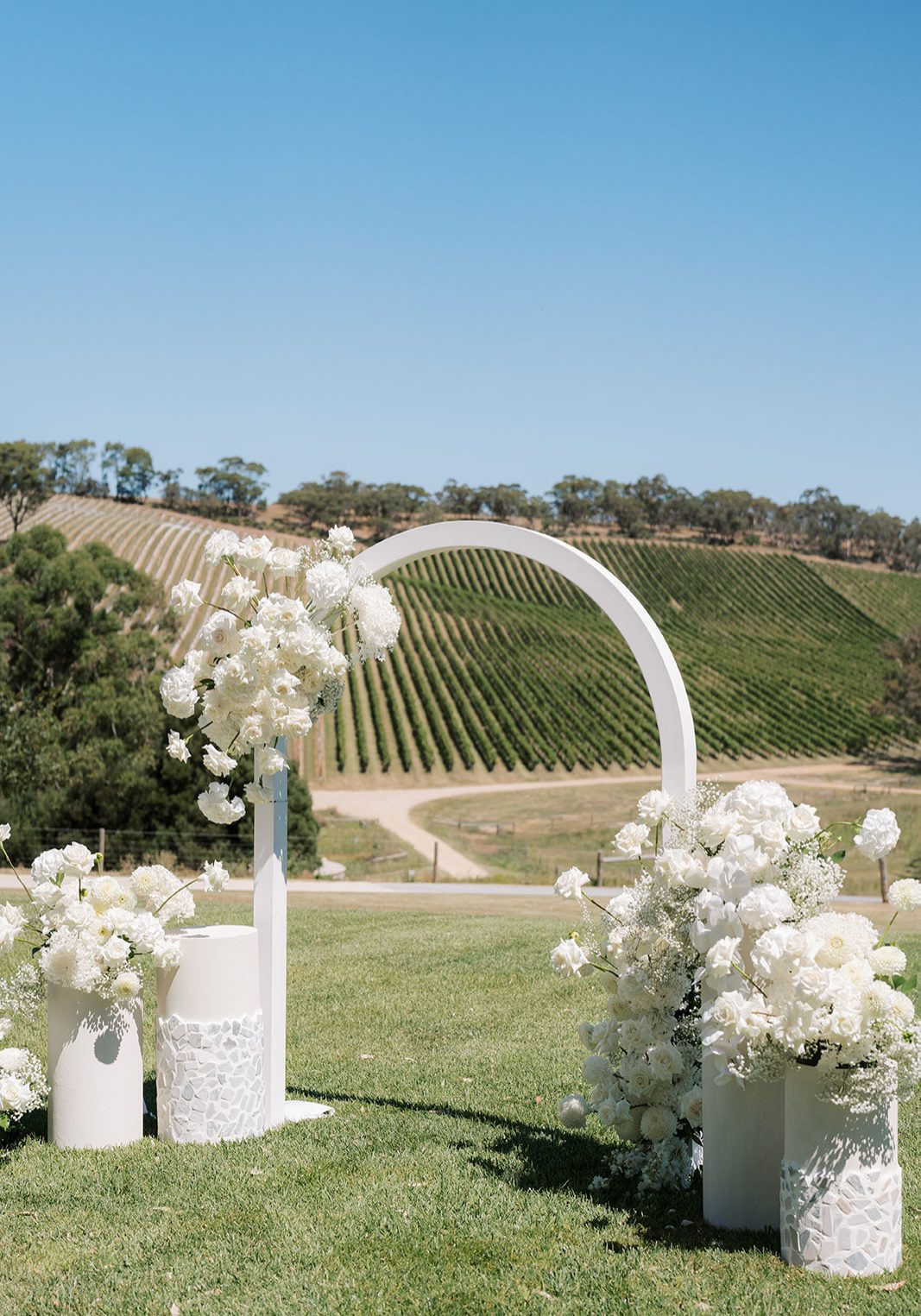 White Arch Arbor with white flowers in Adelaide Hills Vineyard